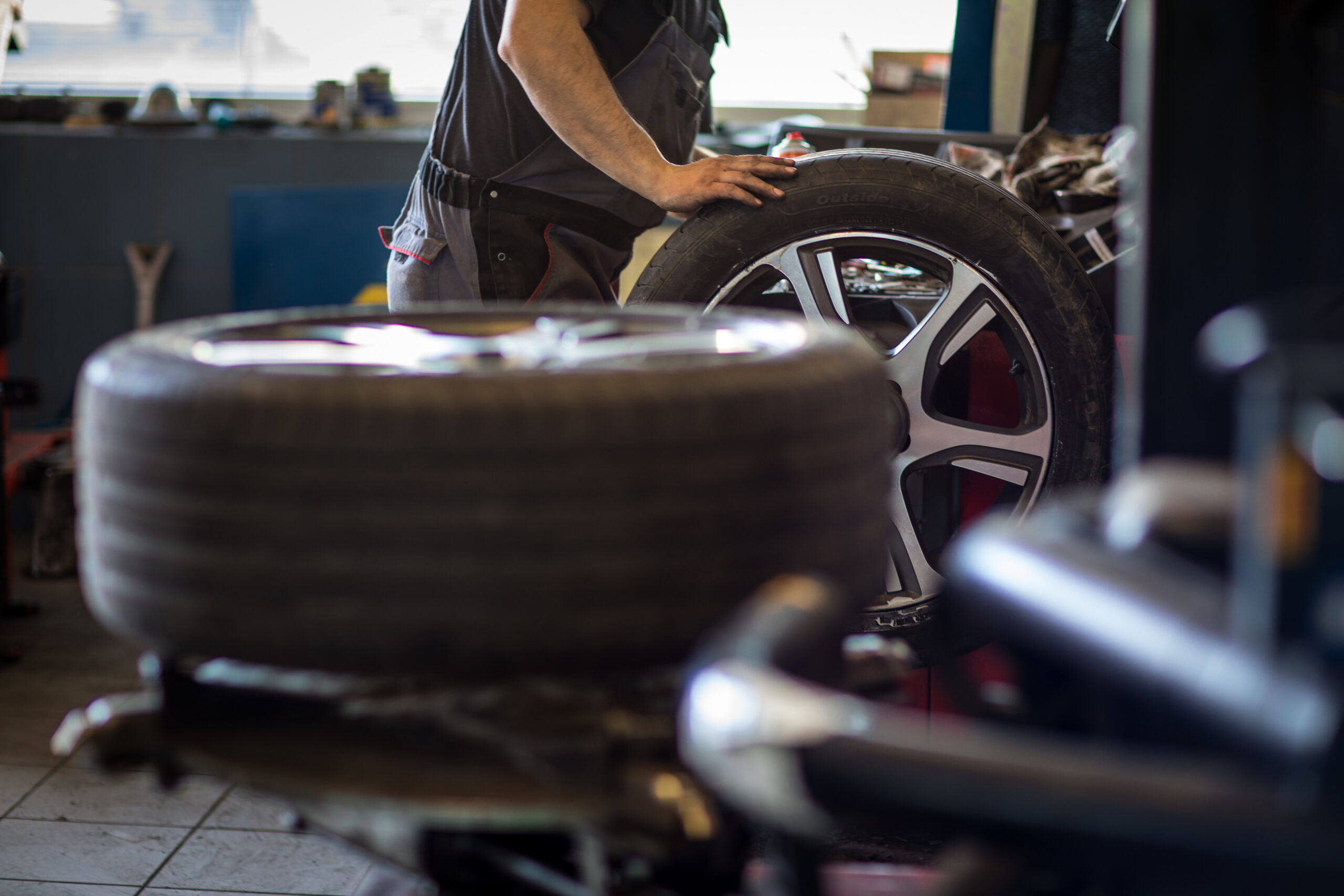 Wheel balancing or repair and change car tire at auto service ga