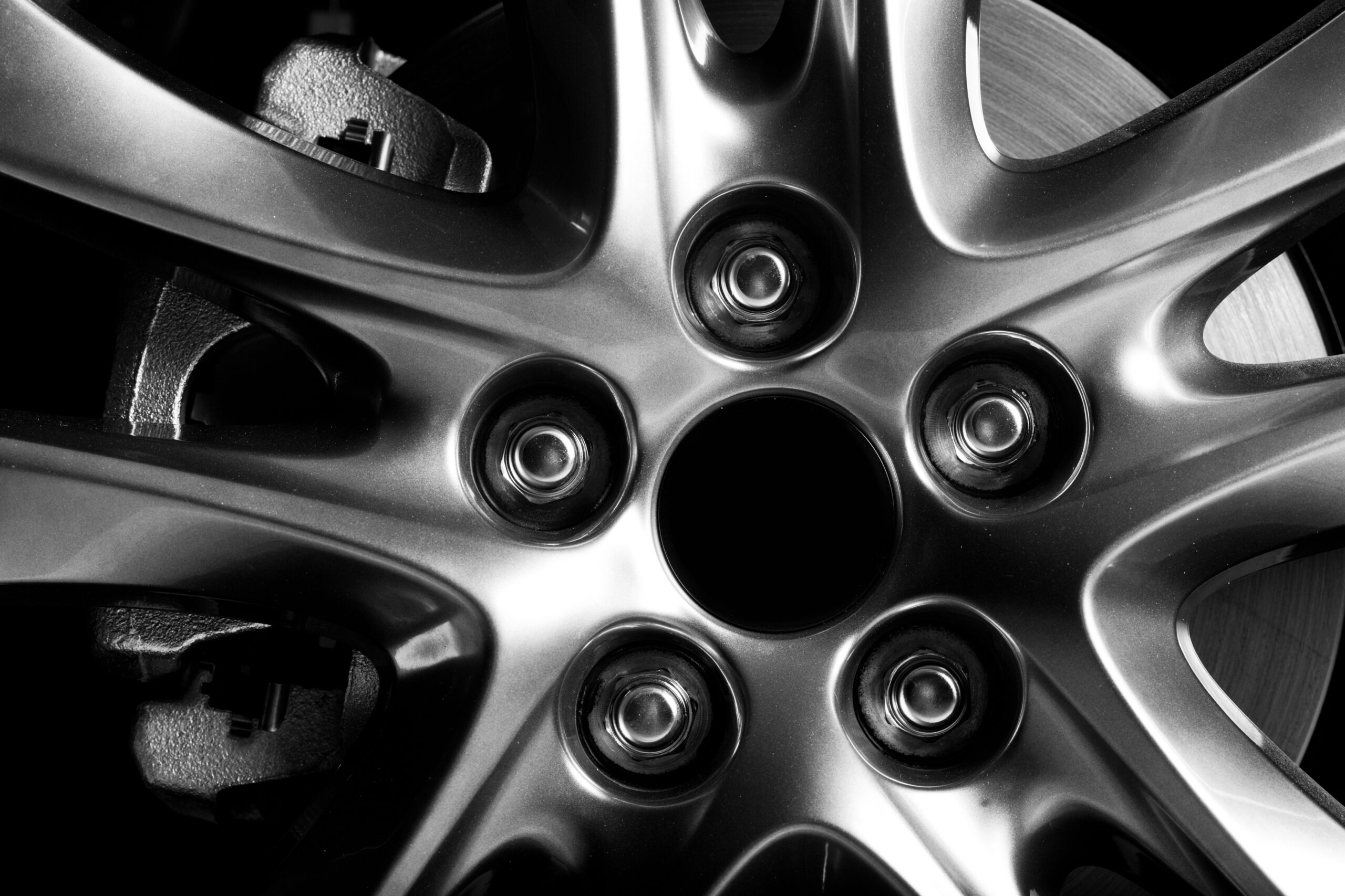 Close-up of aluminium rim of luxury car wheel
